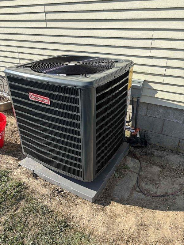 Completed full heat pump system installation for mobile home application. Installed Goodman outdoor condensing unit (model visible in documentation) on concrete pad with proper clearances and leveling, along with Goodman central electric furnace (Model EBE15B, Serial Number W2E5844156) as the air handler. Ran and insulated refrigerant line set between outdoor unit and indoor air handler through foundation penetration. Verified all electrical connections meet manufacturer specifications including dual circuit requirements with proper ampacity and circuit protection. System tested and operational with proper airflow and refrigerant charge confirmed.