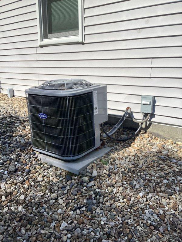Completed basic monthly cooling maintenance visit on residential Carrier air conditioning system. Performed standard inspection of outdoor condensing unit, verified electrical connections at disconnect box, and tested system voltage readings which measured 770 volts on multimeter during operational check. Confirmed refrigerant lines properly insulated, unit level on pad with adequate drainage, and all components functioning within normal parameters.