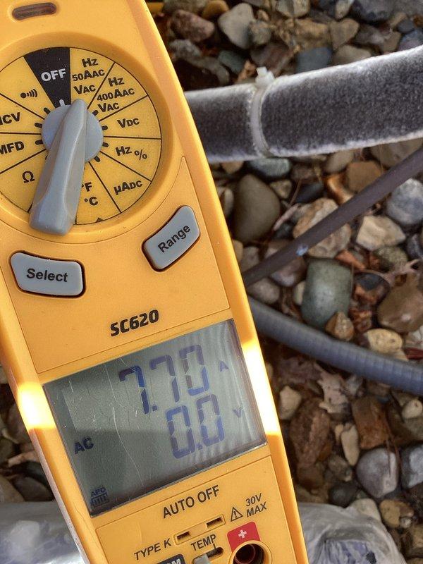 Completed basic monthly cooling maintenance visit on residential Carrier air conditioning system. Performed standard inspection of outdoor condensing unit, verified electrical connections at disconnect box, and tested system voltage readings which measured 770 volts on multimeter during operational check. Confirmed refrigerant lines properly insulated, unit level on pad with adequate drainage, and all components functioning within normal parameters.