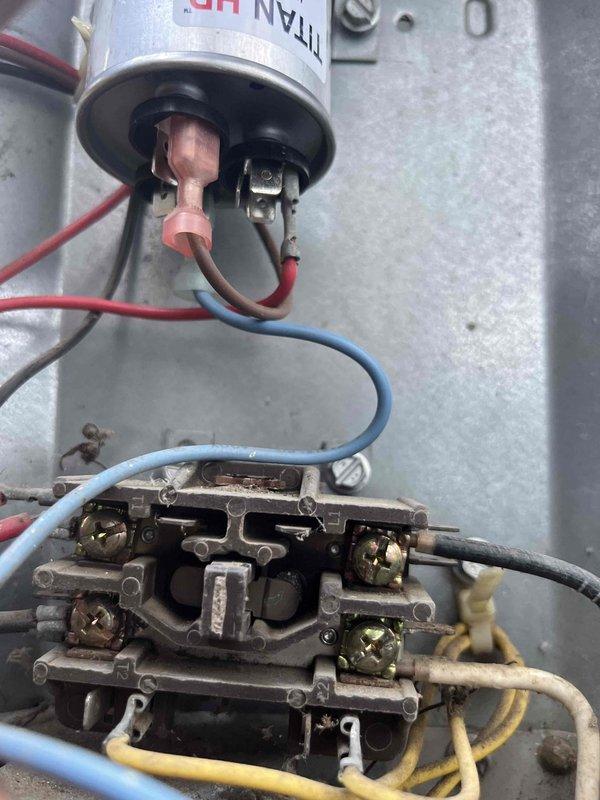 Replaced failed dual run capacitor with new TITAN HD PRFC0353A rated at 35/3 MFD, 440/370 VAC. Disconnected wiring from old capacitor, installed new unit with proper mounting brackets, and reconnected all electrical leads to appropriate terminals on contactor assembly to restore system operation.