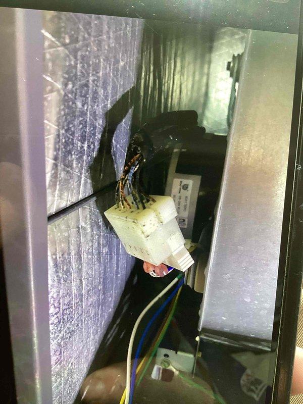 Replaced faulty circuit breaker for heat kit in air handler unit and cleared condensate drain line. Removed access panel to electrical compartment, disconnected defective breaker, installed new breaker, verified proper wire connections and electrical continuity. Cleared blockage from condensate drain pan and drain line to restore proper drainage and prevent water overflow.