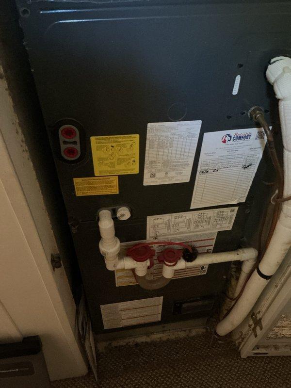 Completed basic monthly cooling maintenance visit on residential HVAC system. Inspected vertical cabinet-style air handler unit and confirmed proper operation of cooling system with thermostat actively calling for cooling (set point 76°F, indoor temperature 78°F). Verified system controls, condensate drain lines with shutoff valves, and overall equipment function per manufacturer specifications.