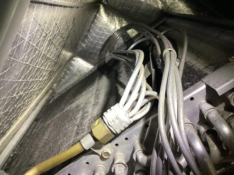 Responded to customer inquiry regarding HVAC system operation and condition. Performed visual inspection of air handler unit and internal components, documenting equipment status with photographs. Inspected evaporator coil, refrigerant lines, electrical connections, condensate drainage system, and ductwork connections. Noted normal dust accumulation on coil surfaces consistent with regular operation. Verified proper installation of all refrigerant piping, electrical wiring, and safety controls. Addressed customer questions regarding system performance and maintenance requirements. Provided technical explanation of equipment operation and recommended routine filter maintenance schedule.
