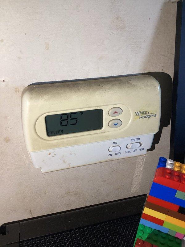 Responded to no cooling call with reported squealing noise prior to system failure. Upon arrival, found system completely inoperative with thermostat displaying 93°F and filter change reminder. Diagnosed failed blower motor in furnace unit after inspecting indoor air handler and ductwork system. Replaced defective blower motor assembly and restored system to normal operation. Verified proper airflow through supply ducts and confirmed all electrical connections secure. System tested and cycling correctly with adequate cooling output.