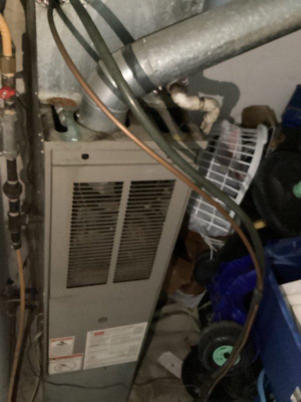 Responded to no cooling call with reported squealing noise prior to system failure. Upon arrival, found system completely inoperative with thermostat displaying 93°F and filter change reminder. Diagnosed failed blower motor in furnace unit after inspecting indoor air handler and ductwork system. Replaced defective blower motor assembly and restored system to normal operation. Verified proper airflow through supply ducts and confirmed all electrical connections secure. System tested and cycling correctly with adequate cooling output.