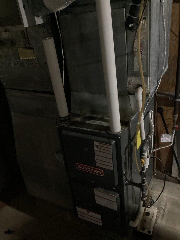 Responded to service call for non-operational air conditioning system with frozen evaporator coil following routine maintenance visit. Upon arrival, confirmed Goodman HVAC system had experienced freeze-up condition overnight. Allowed sufficient time for complete ice thaw on evaporator coil before diagnostic testing. Inspected air filter and found restriction causing reduced airflow across coil. Replaced dirty air filter with proper size filter to restore adequate system airflow. Verified thermostat operation and confirmed unit set to cooling mode at 73°F with current room temperature reading 77°F. Checked refrigerant pressures after thaw cycle completed and found levels within manufacturer specifications. Tested blower motor operation and confirmed proper CFM delivery through supply ductwork. Cycled system through complete cooling cycle and monitored for proper operation without re-freezing. Educated customer on importance of regular filter changes to prevent future freeze-up condition