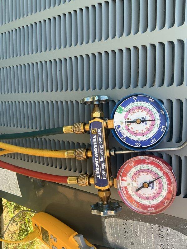 # HVAC Maintenance - Cooling System Service

Completed basic monthly preventive maintenance on residential cooling system. Performed refrigerant pressure diagnostics using manifold gauge set at the outdoor condenser unit, verifying system charge levels and operational parameters across both high and low-side pressures. Inspected electrical components within the condensing unit, including capacitor connections, control board terminals, and associated wiring harnesses to ensure proper electrical integrity and safe operation. All condenser coil fins were found in clean condition with adequate airflow. System operational checks confirmed unit is functioning within normal parameters.