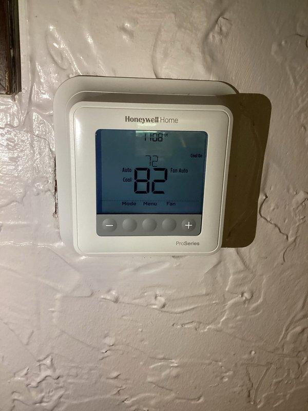 Responded to no-cool service call for 16-year-old American Standard air conditioning system with complete system failure. Upon arrival, confirmed thermostat displayed 82°F with setpoint at 72°F in cooling mode, but unit was not operating. Inspected attic-mounted equipment and found dirty air filter dated from previous service visit, along with significant dust accumulation on system components and surrounding area. Troubleshot electrical components, verified power supply, and identified failed system component preventing unit operation. Replaced defective part, changed air filter, and restored system to normal cooling operation with proper airflow and temperature differential.
