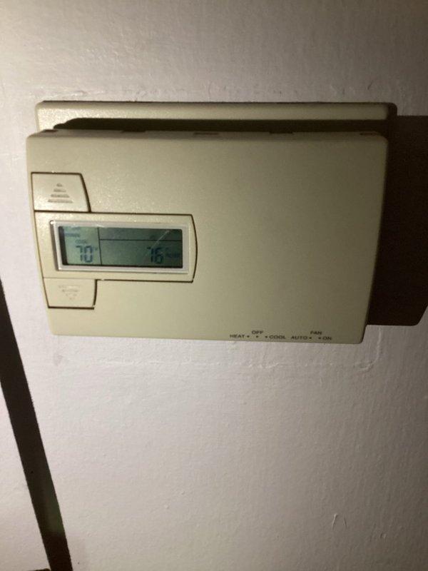 # HVAC Service Report

Responded to emergency no-cool call for seven-year-old Arcoaire air conditioning system. Upon arrival, found thermostat displaying 70°F setpoint with 76°F ambient temperature, indicating unit was not maintaining desired cooling. Performed diagnostic inspection of outdoor condenser unit and indoor components, verified electrical connections, and assessed system operation to restore cooling functionality.