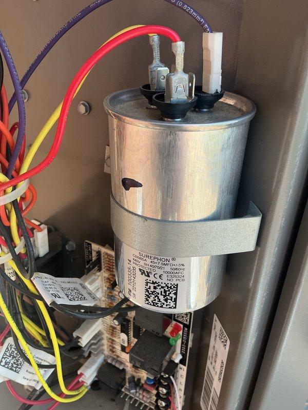 Completed routine HVAC cooling system maintenance inspection. Examined and photographed key components including the damper actuator motor assembly and electrical system containing the run capacitor and control board, verifying proper operation and connections. Discussed warranty coverage details with customer regarding the cooling system maintenance plan.
