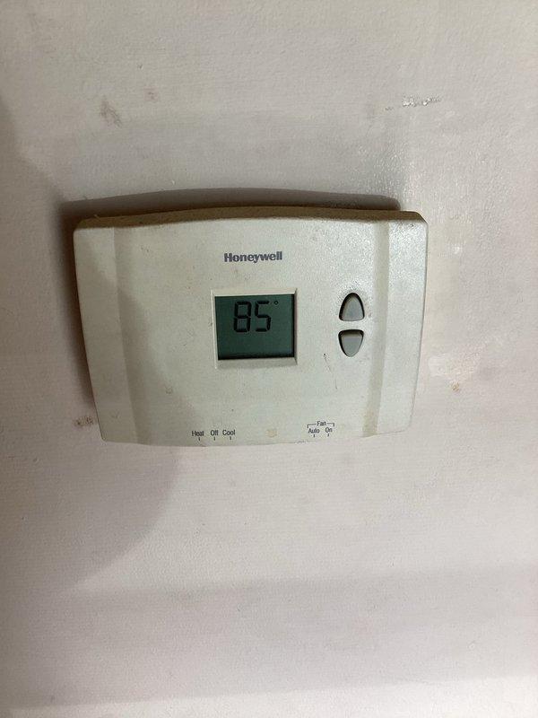 Responded to no-cooling complaint with indoor unit blowing warm air and outdoor condenser not operating. Upon inspection, found outdoor unit completely inoperative with no fan or compressor operation. Diagnosed failed dual run capacitor preventing both condenser fan motor and compressor from starting. Replaced defective capacitor with proper OEM replacement, verified correct microfarad ratings and voltage specifications. Tested system operation, confirmed condenser fan spinning freely, compressor engaging properly, and unit now cooling effectively with thermostat displaying 85°F at time of service.