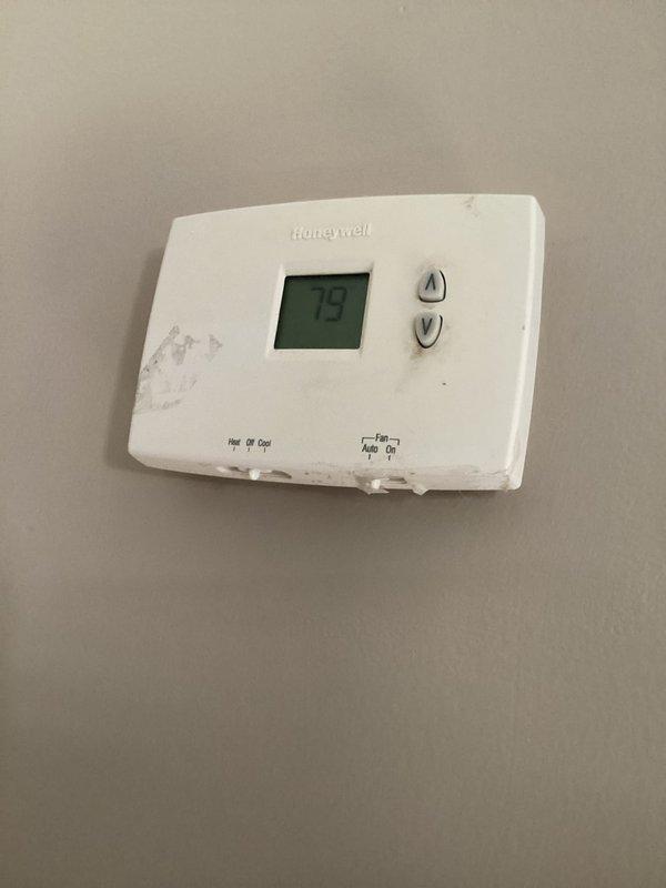 Performed routine maintenance on Goodman AC unit located in dining room, including system diagnostics and performance testing using digital gauges showing superheat and subcool temperatures within normal operating range. Inspected kitchen thermostat for proper operation and discussed commercial membership options with customer.