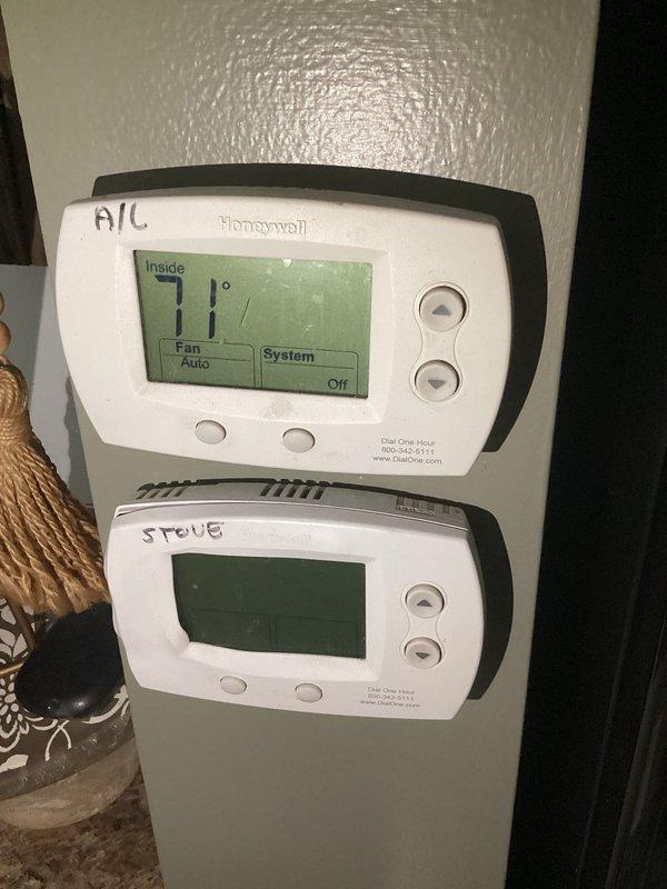 Responded to service call for non-operational air conditioning system affecting entire residence. Upon arrival, inspected 15-year-old Bryant air handler unit and dual-zone Honeywell thermostat configuration controlling separate areas of the home. Performed diagnostic evaluation of indoor air handler, electrical disconnect, refrigerant lines, and condensate drainage system. Verified thermostat settings and system operation modes, documenting equipment condition through photographic documentation of air handler installation and control interface.