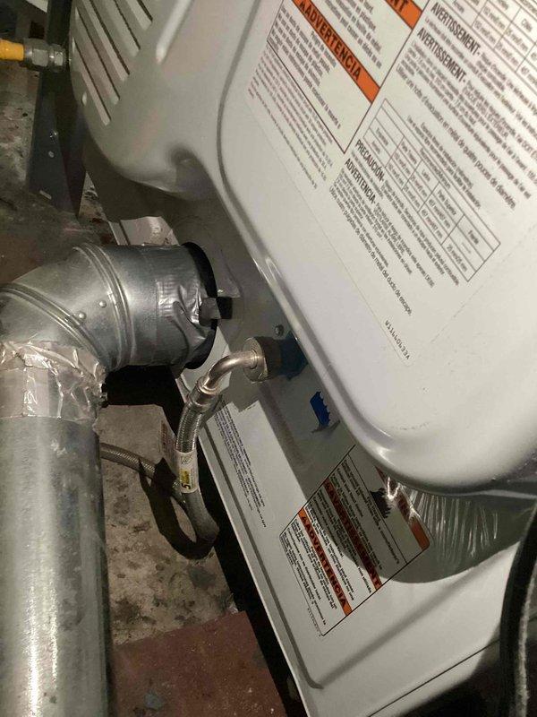 Responded to dryer vent disconnection issue in basement utility area. Found dryer vent completely detached from dryer unit, creating potential lint accumulation and safety hazard. Reinstalled and secured dryer vent ductwork, routing it vertically through wall penetration to ensure proper exterior venting and code compliance.