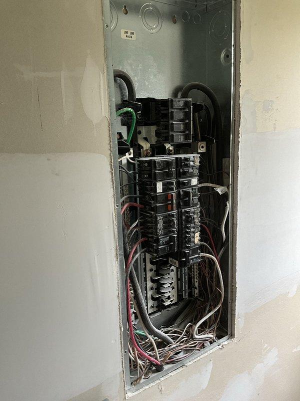 Conducted on-site evaluation of 1992 heat pump system previously diagnosed as failed by another contractor. Accessed unit through rear gate using provided entry code while homeowner was out of state for work. Inspected internal electrical compartment revealing aged wiring, discolored connections, and accumulated debris consistent with 30+ year-old equipment. Documented existing electrical panel and compromised heat pump components. Provided comprehensive photographic documentation of deteriorated wiring harnesses, terminal connections, and overall system condition to support replacement recommendation for antiquated HVAC equipment that has exceeded its serviceable lifespan.