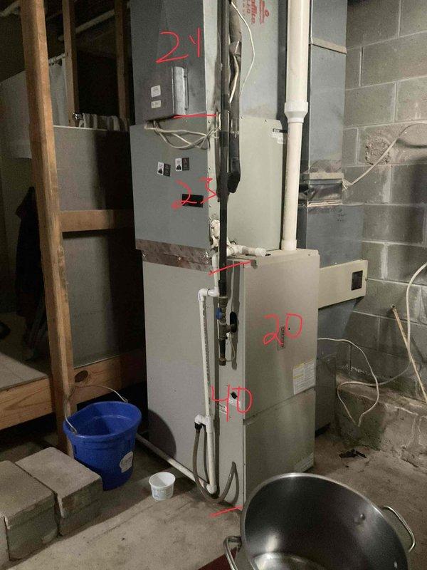 Responded to no cooling call at cabin residence in wooded area. Upon inspection, determined existing HVAC system was beyond economical repair due to age and condition. Evaluated current basement installation consisting of vertically-stacked air handler and furnace components with existing ductwork measuring 20 3/8 x 1 and 21 x 28 x 1 filter sizes. Documented equipment configuration and prepared comprehensive estimate for complete system replacement including new air conditioning unit, air handler, and all necessary components to restore climate control functionality to the property.