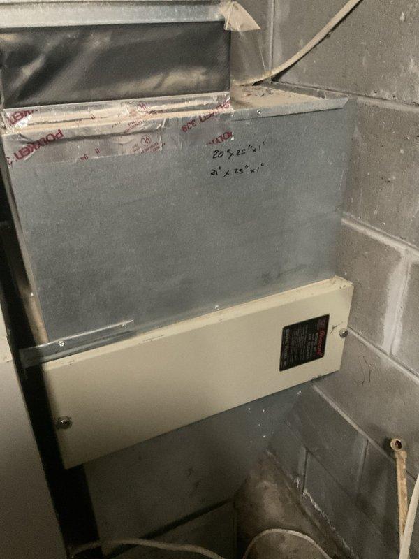 Responded to no cooling call at cabin residence in wooded area. Upon inspection, determined existing HVAC system was beyond economical repair due to age and condition. Evaluated current basement installation consisting of vertically-stacked air handler and furnace components with existing ductwork measuring 20 3/8 x 1 and 21 x 28 x 1 filter sizes. Documented equipment configuration and prepared comprehensive estimate for complete system replacement including new air conditioning unit, air handler, and all necessary components to restore climate control functionality to the property.