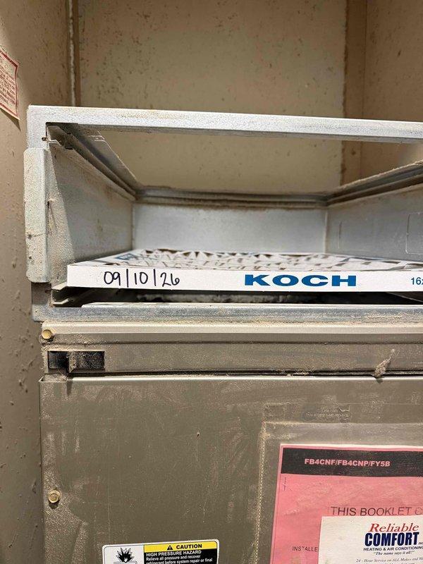 Completed basic monthly cooling maintenance on residential HVAC system. Inspected outdoor condenser unit, verified operational status of fan and compressor, and checked electrical connections at disconnect box. Accessed indoor air handler, inspected existing filter with KOCH branding showing previous service date, and performed standard system checks. Note: 16x20x4 filter not included with this maintenance service per agreement.