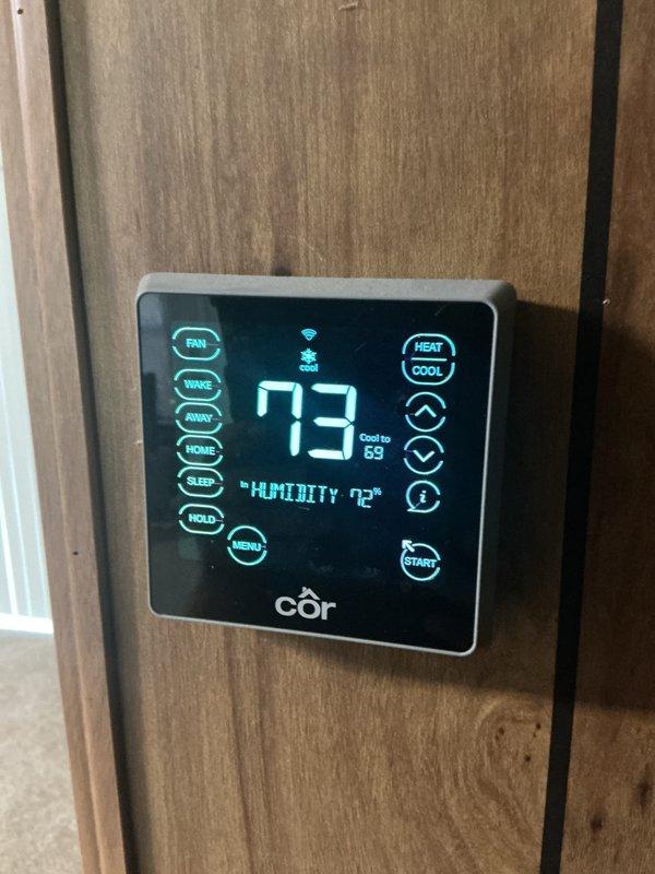 Completed cooling preventative maintenance service on residential HVAC system. Performed system diagnostics, checked refrigerant pressures and temperatures using manifold gauge set, verified thermostat operation showing system cooling to setpoint of 68°F with ambient reading of 73°F. Standard monthly filter replacement due (20x20x4 filter not included in service).