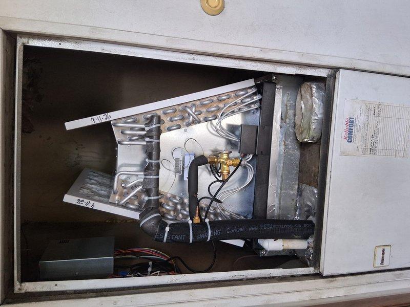 Completed full HVAC system installation for mobile home, including new air conditioning unit and evaporator coil assembly. Installed evaporator coil with aluminum fin serpentine configuration within metal cabinet housing, secured all refrigerant lines, electrical connections, and brass fittings. Mounted condensing unit with protective grille guard and verified proper system operation using Fieldpiece digital diagnostic equipment. Confirmed refrigerant charge levels, electrical connections, and overall system performance met manufacturer specifications. Customer financing paperwork completed and identification documentation secured on file.