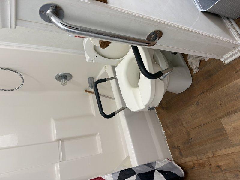 Responded to service call for multiple plumbing fixtures experiencing backup issues, including two toilets and water bubbling through bathroom floor when tub drained. Accessed property through patio entrance as directed. Upon inspection, identified main drain line obstruction causing simultaneous backup in multiple fixtures. Performed main drain cleanout procedure to clear blockage and restore proper drainage throughout the plumbing system. Tested all affected fixtures post-service to verify proper flow and drainage restoration. System returned to normal operation with no further backup issues observed.