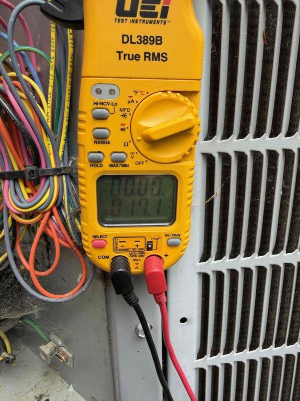 # HVAC Maintenance - Heating System Service

Completed basic monthly heating maintenance visit on CCHP system. Performed standard diagnostic procedures including electrical testing and system verification using digital multimeter to measure voltage, continuity, and electrical parameters across control circuits and components. Inspected all wire connections, control board terminals, and junction points for proper contact and secure mounting.

Verified proper operation of heating controls and electrical circuits. All multicolored control wiring including thermostat leads, safety circuits, and component connections were inspected and found secure with appropriate zip tie management. Tested electrical values at various connection points within the unit to ensure system components are receiving correct voltage and operating within manufacturer specifications.

Examined interior components of heating unit including control board, wire harnesses, and electrical connections. All wiring bundles