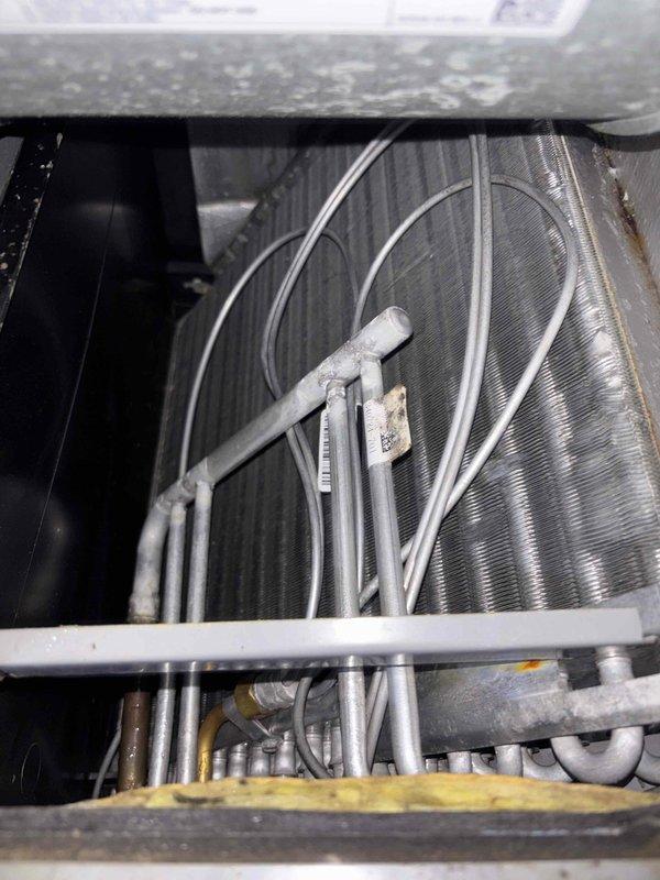 Completed basic monthly cooling maintenance on HVAC system including inspection of evaporator coil assembly, refrigerant lines, and condensate drainage components. Installed 20x20x1 filter, verified all connections and tubing were secure, and confirmed proper operation of air handler unit with all components functioning within normal parameters.