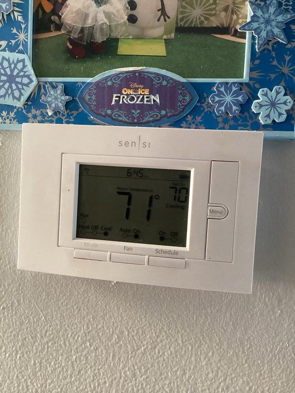 Completed monthly preventative maintenance on residential heating system. Performed comprehensive inspection of furnace unit, verified thermostat operation at 71°F, and confirmed all system controls and safety mechanisms functioning properly. Documented equipment condition with photos showing operational status of both thermostat and heating unit, with all components operating within normal parameters.