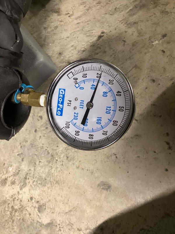 Responded to critical warning indicator on thermostat. Performed diagnostic evaluation of HVAC system and measured refrigerant pressures at service port using calibrated gauge. Observed normal condensation on suction line indicating proper refrigerant flow and system operation. Verified system pressures within manufacturer specifications and confirmed air conditioning unit operating correctly with no actual critical issues present.