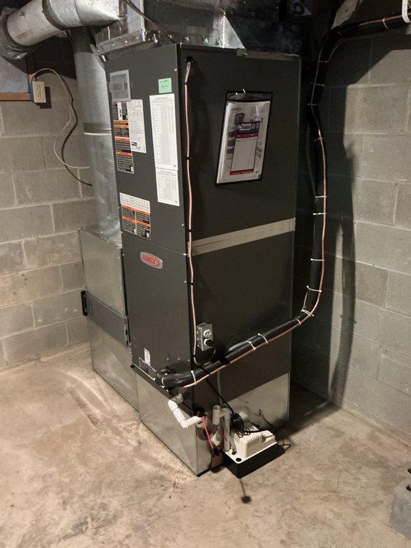 Completed comprehensive heating maintenance on residential HVAC system consisting of furnace and heat pump components installed in basement location. Performed thorough inspection of dual-unit configuration with interconnected refrigerant lines and electrical connections. Replaced 20x20x4 air filter as part of routine maintenance protocol. Verified proper operation of all system components including condensate pump, refrigerant line connections, and electrical wiring. Confirmed active comfort care plan coverage extending through March 2028. All equipment found in good working condition with no visible signs of deterioration, rust, or operational issues. System operating within normal parameters upon completion of maintenance service.
