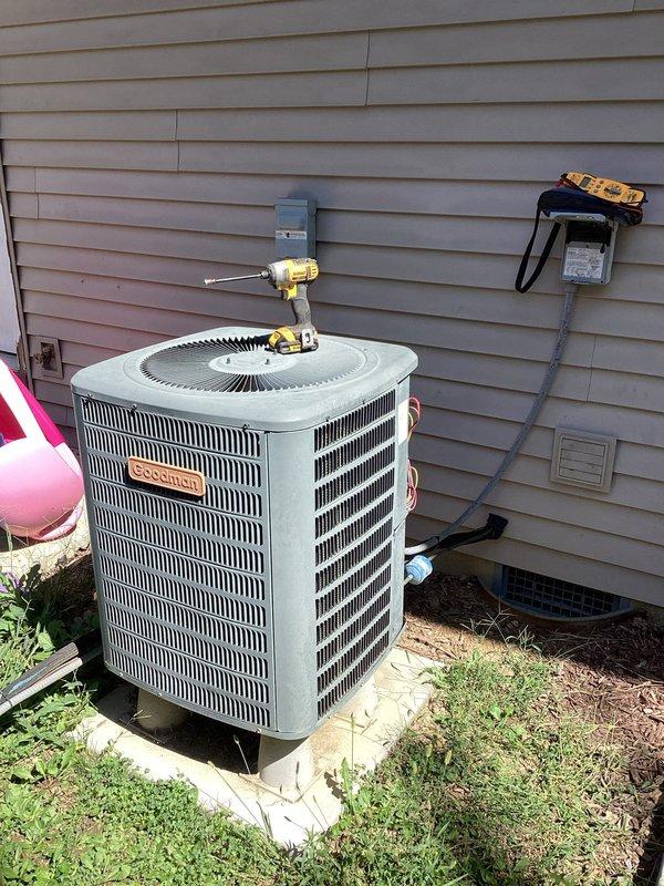 Responded to no cooling complaint on Goodman air conditioning system. Upon inspection, confirmed compressor failure preventing unit operation. Performed diagnostic evaluation and documented equipment condition with photos of outdoor condenser unit and indoor thermostat displaying 73°F. Completed maintenance plan inspection report as required.