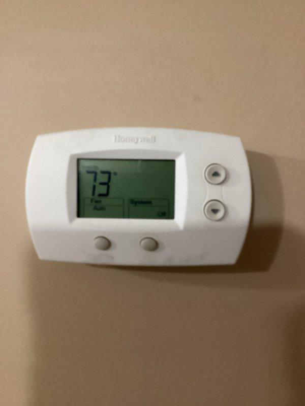 Responded to no cooling complaint on Goodman air conditioning system. Upon inspection, confirmed compressor failure preventing unit operation. Performed diagnostic evaluation and documented equipment condition with photos of outdoor condenser unit and indoor thermostat displaying 73°F. Completed maintenance plan inspection report as required.