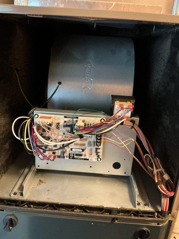# HVAC Maintenance - Maint - Cool

Completed comprehensive cooling maintenance on two systems per basic monthly service agreement. Performed standard maintenance procedures including inspection of all major components, electrical connections, and control boards. Replaced 14x20x1 air filter as included in service plan.

During inspection of outdoor unit, observed significant environmental wear with visible rust staining, moisture accumulation in base pan, and debris buildup around unit exterior. Checked dual capacitor configuration and verified electrical connections on both silver replacement capacitor and existing capacitor. Tested voltage and amperage readings using digital meter to ensure proper system operation. Noted standing water in condensate area and organic debris at unit base, indicating potential drainage concerns that should be monitored.

Indoor system inspection revealed control board in operational condition with all wire terminations secure at terminal strip. Verified 