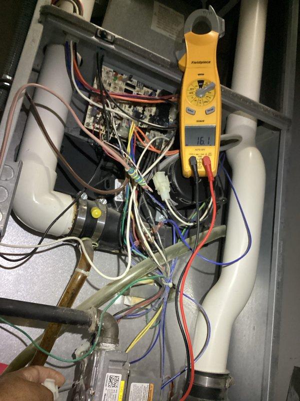 Completed annual heating maintenance visit under active service agreement. Performed comprehensive system inspection including electrical diagnostics with amp draw readings of 16.1A on primary heating components. Verified all electrical connections, control board operation, and safety circuits functioning within manufacturer specifications. Replaced 18x18x1 air filter as part of routine maintenance protocol. Inspected tankless water heater unit showing operational temperature of 130°F, confirmed proper venting through PVC exhaust system, and verified all shut-off valves and connections secure with no leaks detected. All systems tested and operating efficiently with no deficiencies noted.