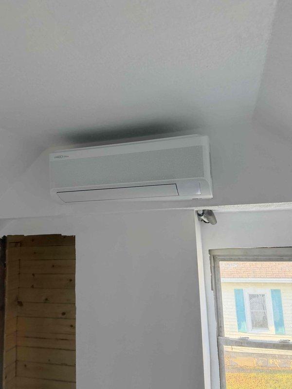 Completed installation of Lennox ductless mini-split system including indoor wall-mounted evaporator unit and outdoor condensing unit. System was commissioned, refrigerant pressures verified at proper levels, and all components tested to confirm optimal operation and cooling performance.