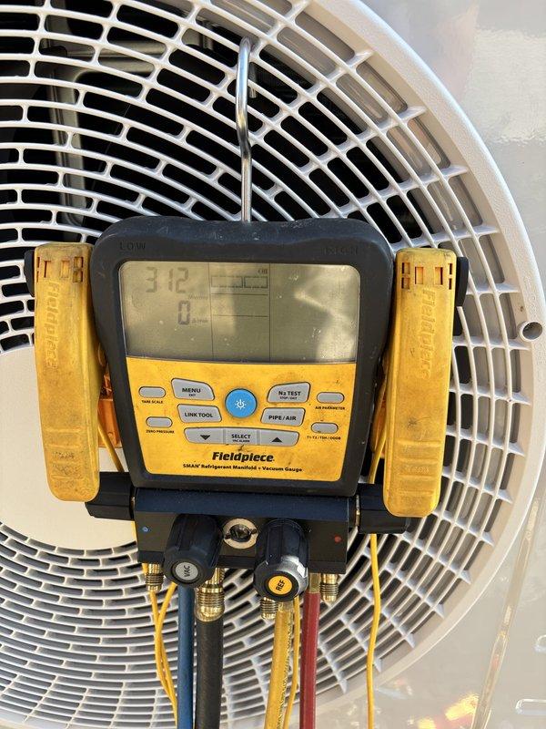 Completed installation of Lennox ductless mini-split system including indoor wall-mounted evaporator unit and outdoor condensing unit. System was commissioned, refrigerant pressures verified at proper levels, and all components tested to confirm optimal operation and cooling performance.