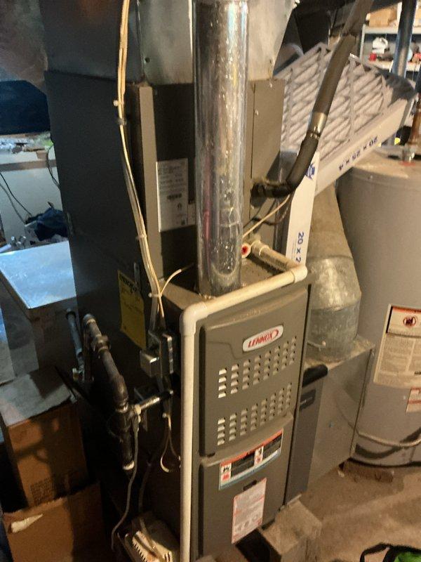 Completed routine cooling maintenance on residential split system with Lennox furnace and outdoor condenser unit. Performed standard inspection of both indoor and outdoor components, verified system operation, and documented equipment condition per Basic CCC maintenance agreement specifications. Customer notified that 20x25x4 filter is not included in service plan.
