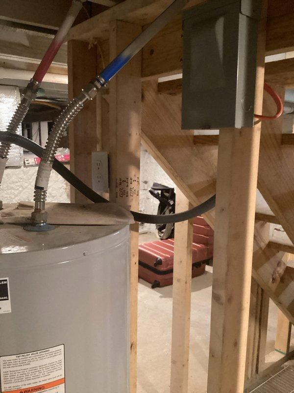 Conducted on-site evaluation of residential plumbing system to provide water softener installation options. Assessed existing water heater location, available installation space in utility area, and plumbing configuration including hot and cold water supply lines with shut-off valves. Documented current mechanical room layout and identified optimal placement for water treatment equipment installation, taking into account accessibility for future maintenance and connection points to main water supply.
