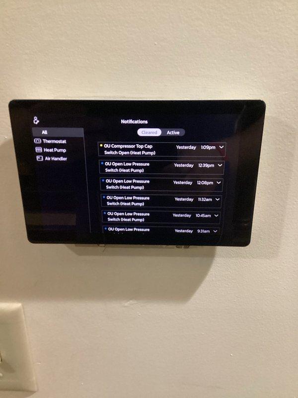 Responded to service call for newly installed system not maintaining set temperature. Upon arrival, reviewed control panel notifications showing multiple active alerts including compressor top cap switch open and low pressure switch faults on heat pump outdoor unit. Inspected air handler installation in basement and verified proper ductwork connections and refrigerant line routing. System operational but experiencing intermittent pressure-related faults preventing adequate cooling capacity. Documented equipment conditions and alert history for further diagnostic evaluation and resolution of pressure switch issues affecting temperature control performance.
