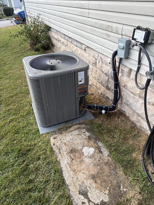 Completed full installation of Lennox air conditioning system and evaporator coil at residential property. Installed outdoor condensing unit on concrete pad adjacent to exterior wall with proper clearances maintained. Mounted electrical disconnect box on exterior wall and ran electrical conduit and refrigerant line set through wall penetration to indoor air handler location. All connections secured with appropriate mounting brackets and sealed per manufacturer specifications. Added new supply vent register in carpeted interior space to improve airflow distribution throughout conditioned area. System startup performed, refrigerant charge verified, and all operational parameters confirmed within normal range. Installation financed through approved service financing program with signed agreement and identification documentation retained on file.