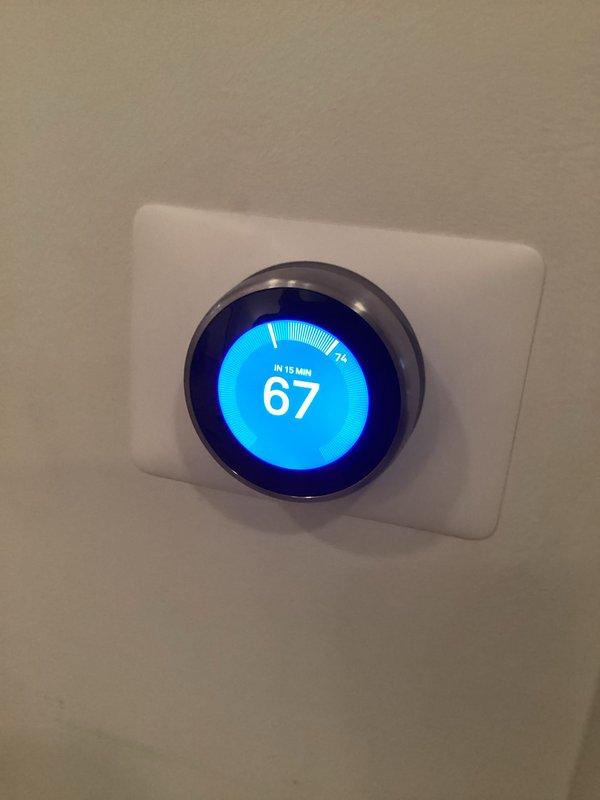 Responded to customer inquiries regarding HVAC system operation and thermostat functionality. Documented current system configuration showing digital thermostat set to 67°F with proper operation and basement furnace installation with gas line, PVC condensate drainage, and ductwork connections all in satisfactory working condition.