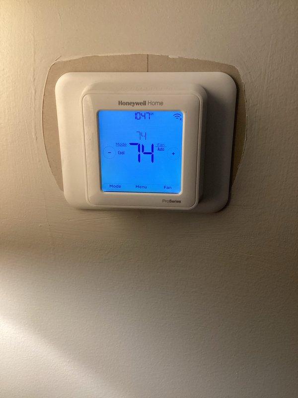 Completed monthly basic heating maintenance visit at residential property. Inspected Honeywell Home Pro-Series digital thermostat confirming proper operation at 74°F setpoint with Wi-Fi connectivity functional. Verified HVAC air handling unit accessibility and documented 28x30x2 Filterbuy filter currently installed in system, noting customer provides their own filters per service agreement.
