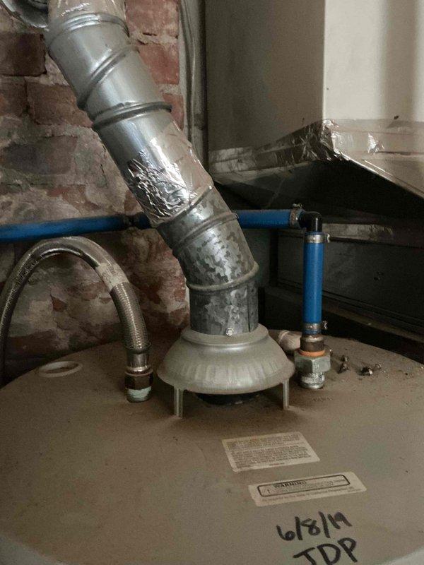 Completed monthly prepaid plumbing inspection of residential water heater and laundry area. Examined water heater venting system, confirmed proper installation of metallic vent pipe, and inspected PEX supply lines and connections for leaks or deterioration. Verified washing machine water supply hookups and drainage connections are secure and functioning properly, with no visible signs of active leaks or immediate concerns noted during inspection.