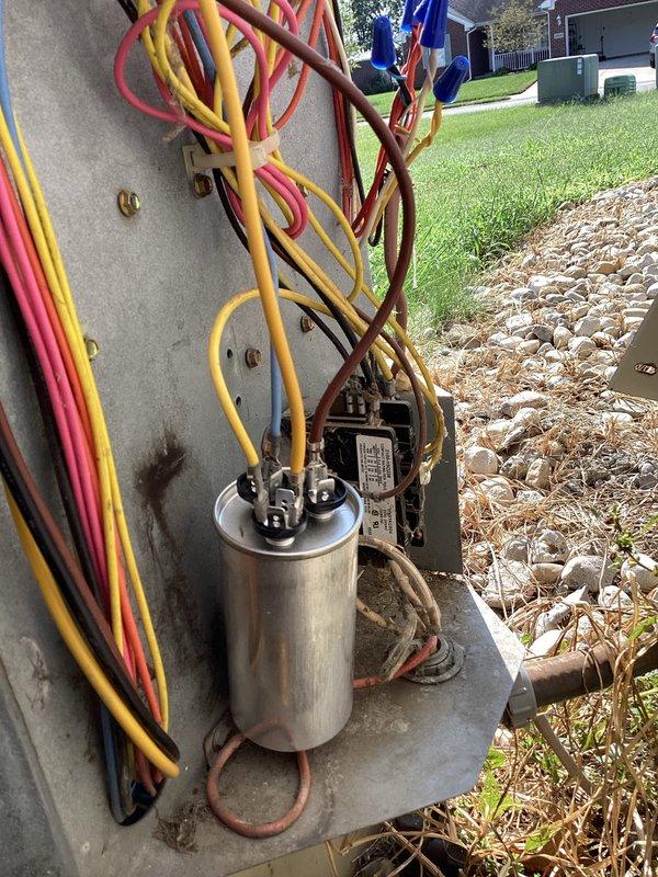 Completed annual basic heating maintenance visit on residential HVAC system. Performed standard inspection of stacked air handler and furnace unit, verified proper operation of all components, and documented filter size with photographs for future reference. Inspected outdoor electrical components including capacitor and contactor, confirmed all wire connections secure and system operating within normal parameters.