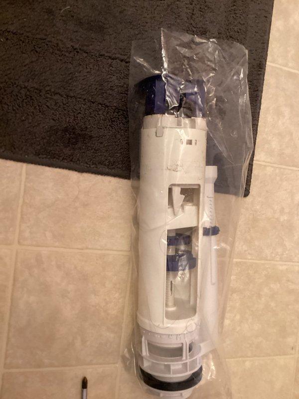 Replaced defective toilet flush valve assembly with new unit. Removed old fill valve mechanism and installed replacement component featuring adjustable height settings and improved water flow control. Tested system operation to ensure proper tank filling, water shutoff at correct level, and elimination of running water issues.