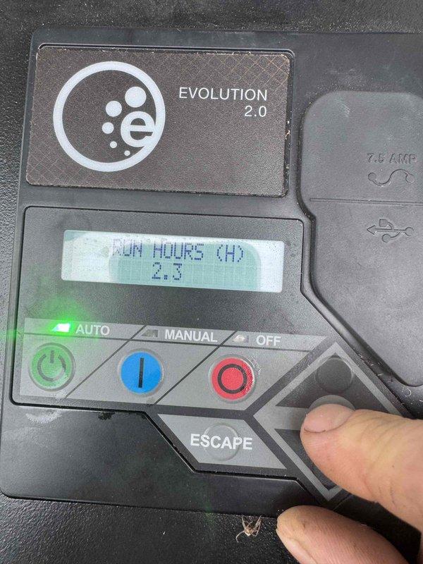 Performed scheduled maintenance on residential standby generator equipped with Evolution 2.0 controller. Verified battery condition reported as good on diagnostic display, confirmed unit operational status with 2.3 run hours logged on system. Tested AUTO mode functionality and verified all control panel operations including manual and off modes responding properly.