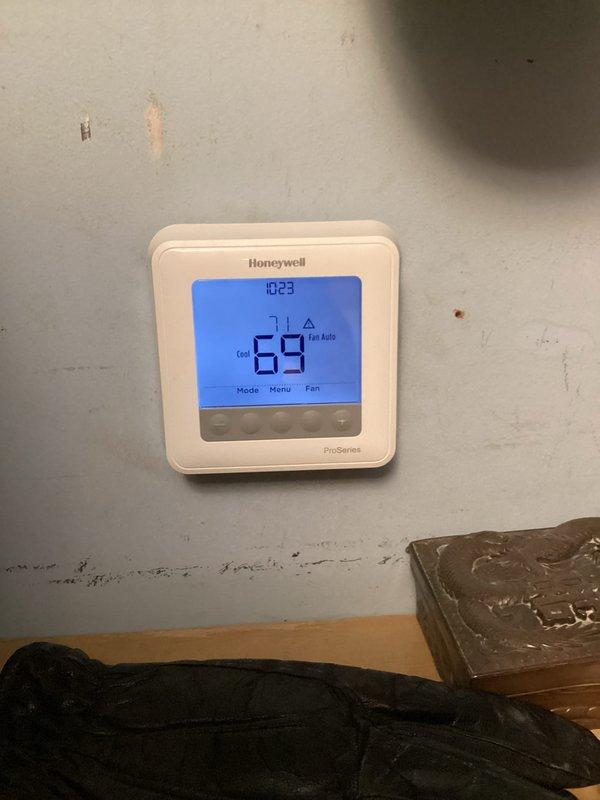 Completed basic monthly maintenance on heating system. Performed standard filter change and system inspection. Verified thermostat operation showing 69°F current temperature with heat mode active and proper display functionality.