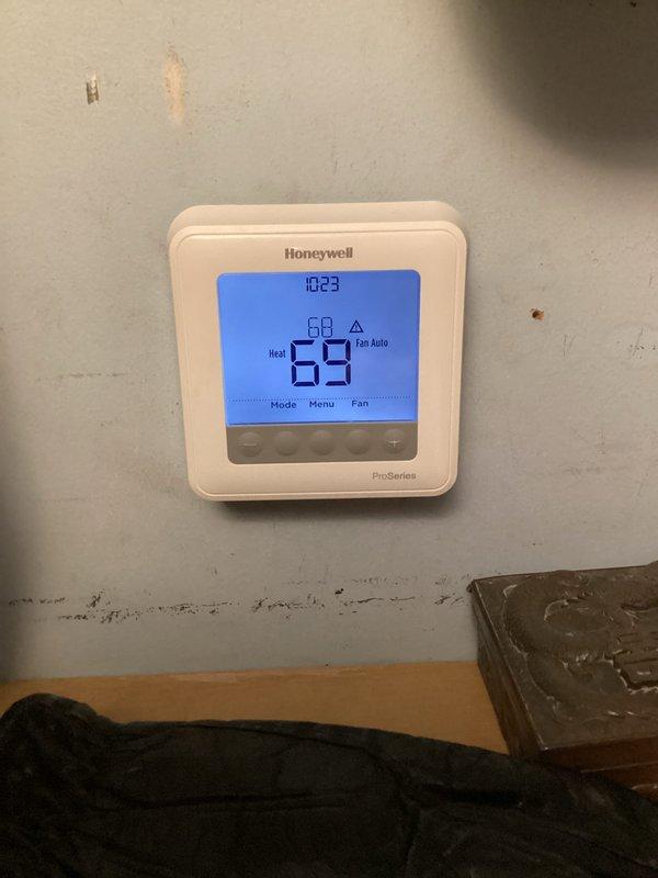 Completed basic monthly maintenance on heating system. Performed standard filter change and system inspection. Verified thermostat operation showing 69°F current temperature with heat mode active and proper display functionality.