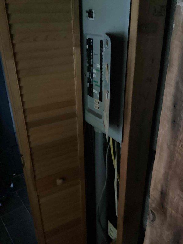Conducted on-site assessment for tankless water heater and water softener installation. Evaluated existing electrical panel capacity and configuration to determine compatibility with proposed equipment, documenting current breaker layout and available amperage for future installation requirements.