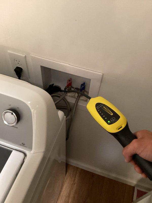 Responded to service call for persistent sewer odor in residential property. Customer had previously replaced toilet wax ring without resolving the issue. Conducted diagnostic inspection of plumbing system using gas detection equipment to identify source of sewer smell. Inspected accessible plumbing connections behind water heater, including water supply lines, shut-off valves, and drain piping in utility area. Performed measurements and readings with handheld diagnostic meter to assess potential sewer gas leaks or venting issues. Provided estimate for sewer line repair work based on findings from inspection and diagnostic testing.